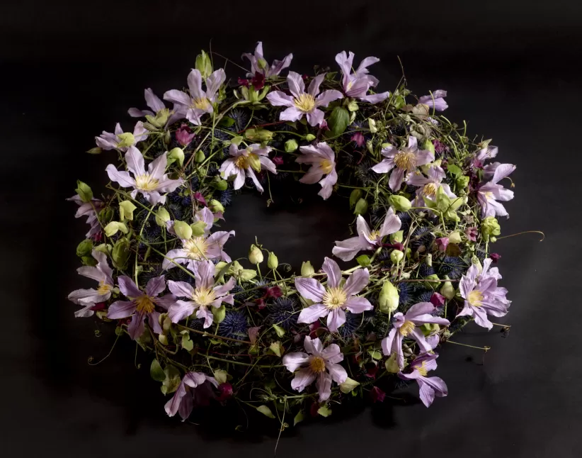 Funeral wreath with Clematis Amazing London and Eryngium (Supernova, Magnetar and Orion Questar®)