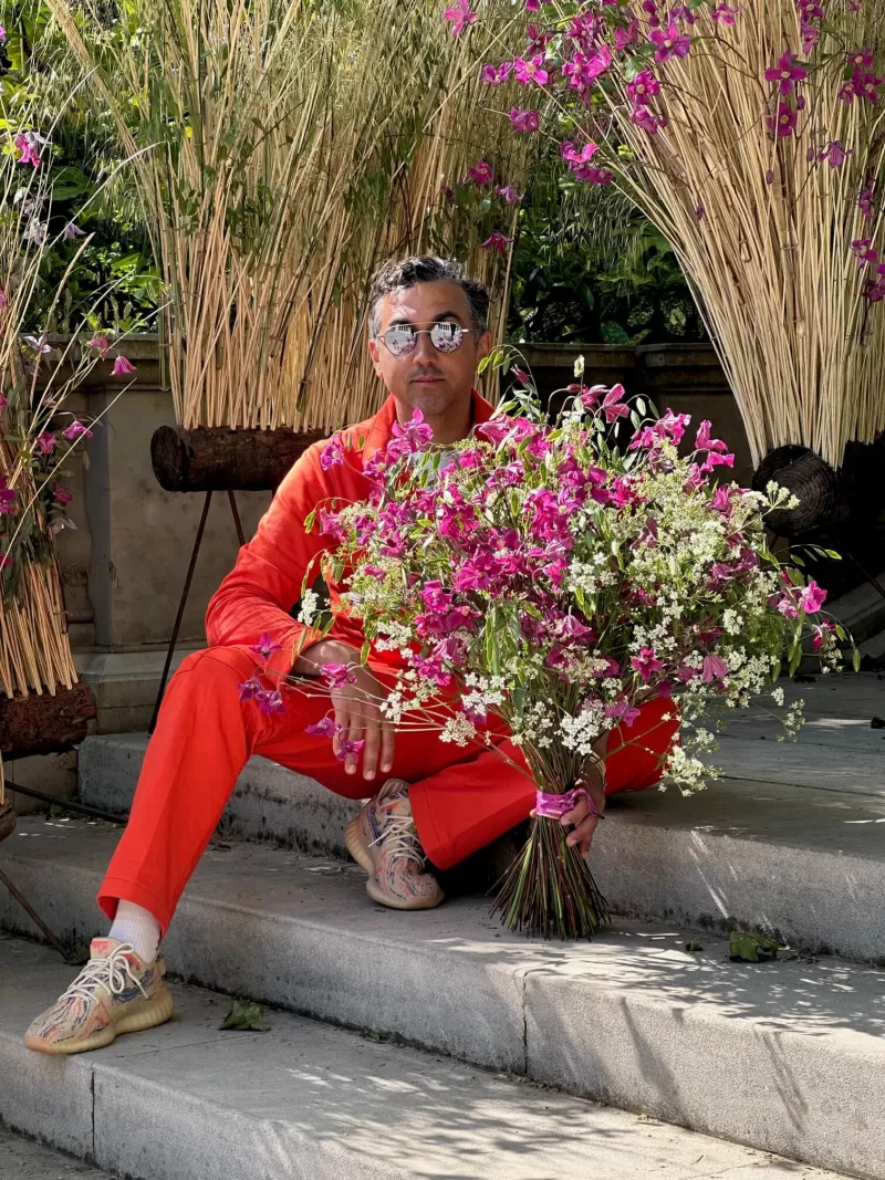 Dmitry Turcan holding Clematis bouquet 