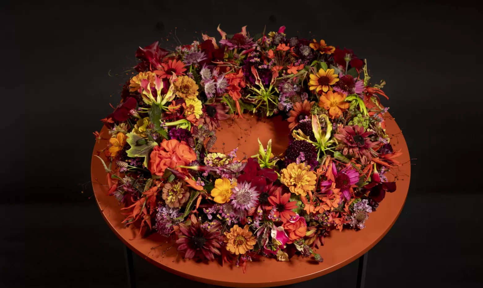 Funeral wreath with Astrantia, Gloriosa, Limonium, Scabiosa and Talinum